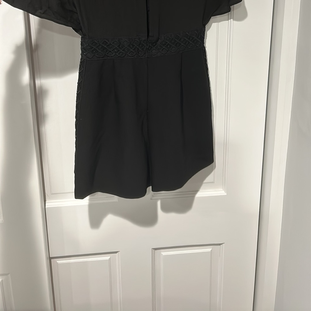 Never worn is small in the back , is ver sexy for who is lucky to fit .